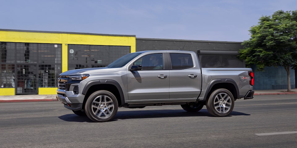 The 2023 Satin Steel Metallic Chevy Colorado Driving on an Open Road