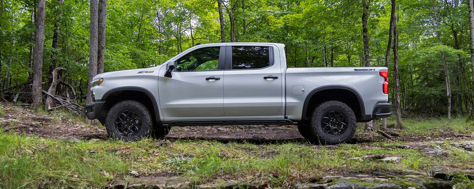 The 2023 Silverado ZR2 Bison Stopped in the Woods on an Off-Road Trail