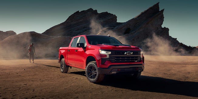 2023 Chevrolet Silverado Pickup Truck Three-Quarters View Parked by Mountains