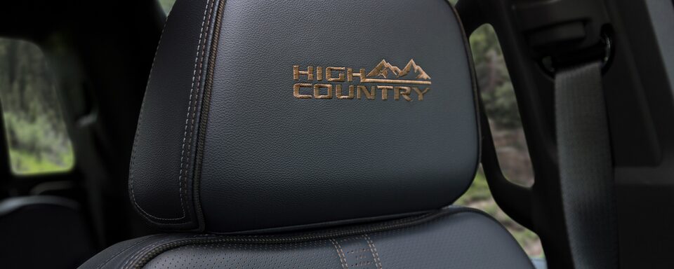 The High Country Logo Stitched into the Headrest of the 2023 Silverado High Country
