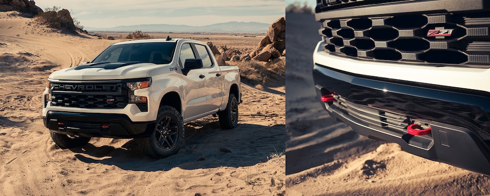 The Summit White 2023 Silverado Parked on an Incline in the Desert Along Side a Close up of Their Tow Hooks