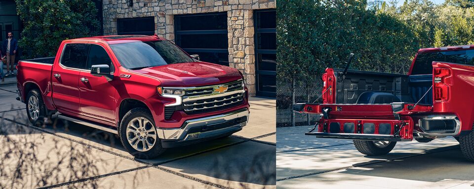 The Red Hot Silverado Parked In Front of a Beautiful Home Along Side A Silverado With the MultiFlex Tailgate in Action
