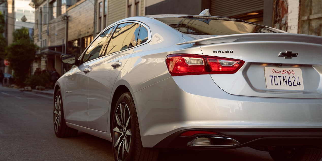 Rear Exterior View Of The 2024 Chevy Malibu Tail Light Driving In A City