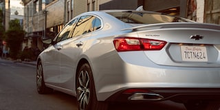 Rear Exterior View Of The 2024 Chevy Malibu Tail Light Driving In A City