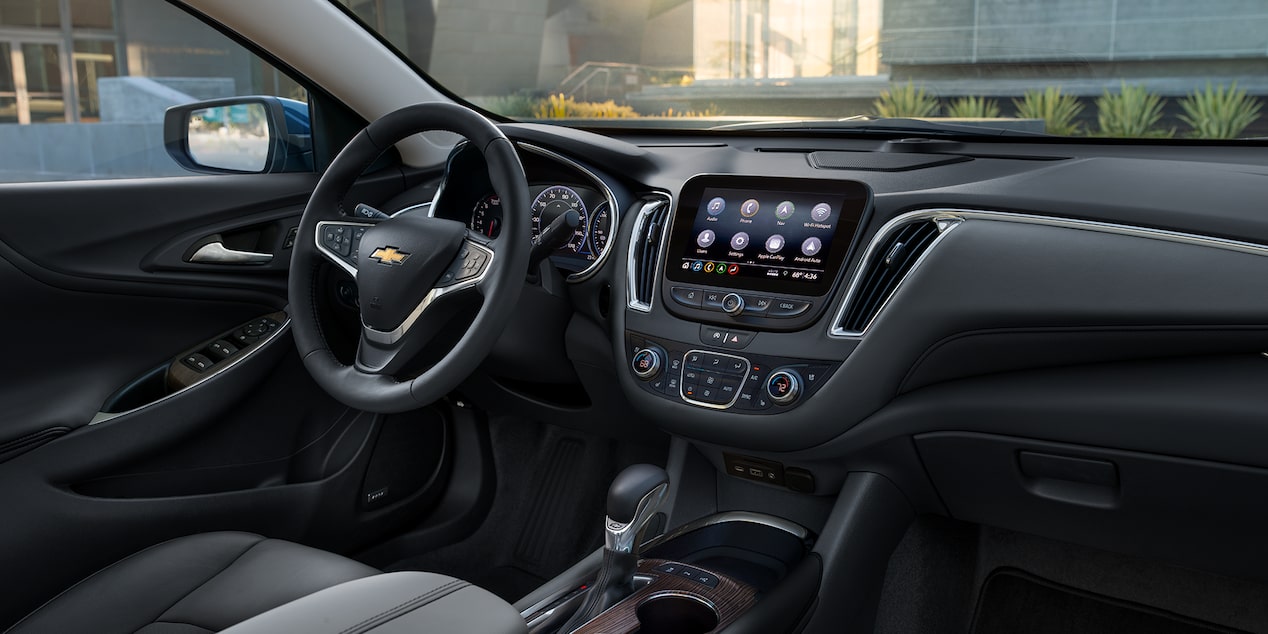 2024 Chevy Malibu Interior Front View of Steering Wheel, Dashboard, Infotainment System, and Drivers Seat