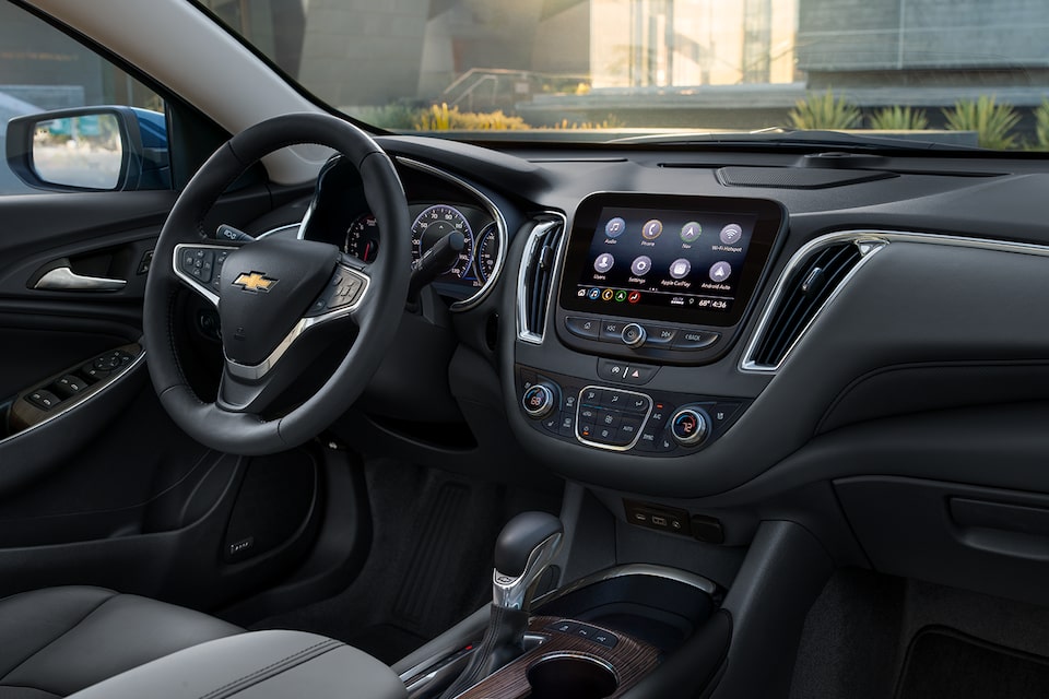 Front Row Interior Overview Of Dashboard and Steering Wheel Inside The 2024 Chevy Malibu