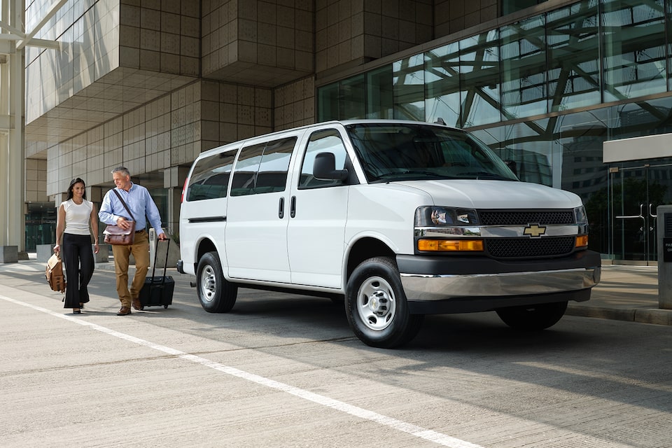 2024 Chevy Express Passenger Van Parked at Airport