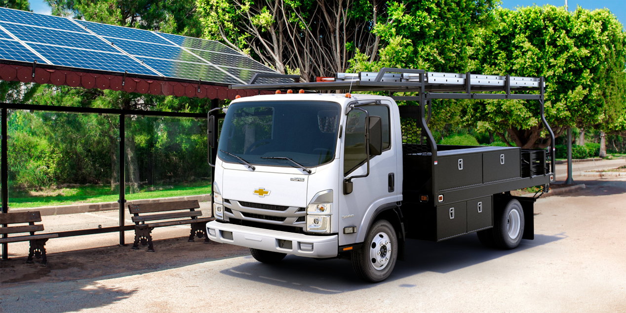 2024 Chevy Low Cab Forward Parked Next to Park Benches and Solar Panels