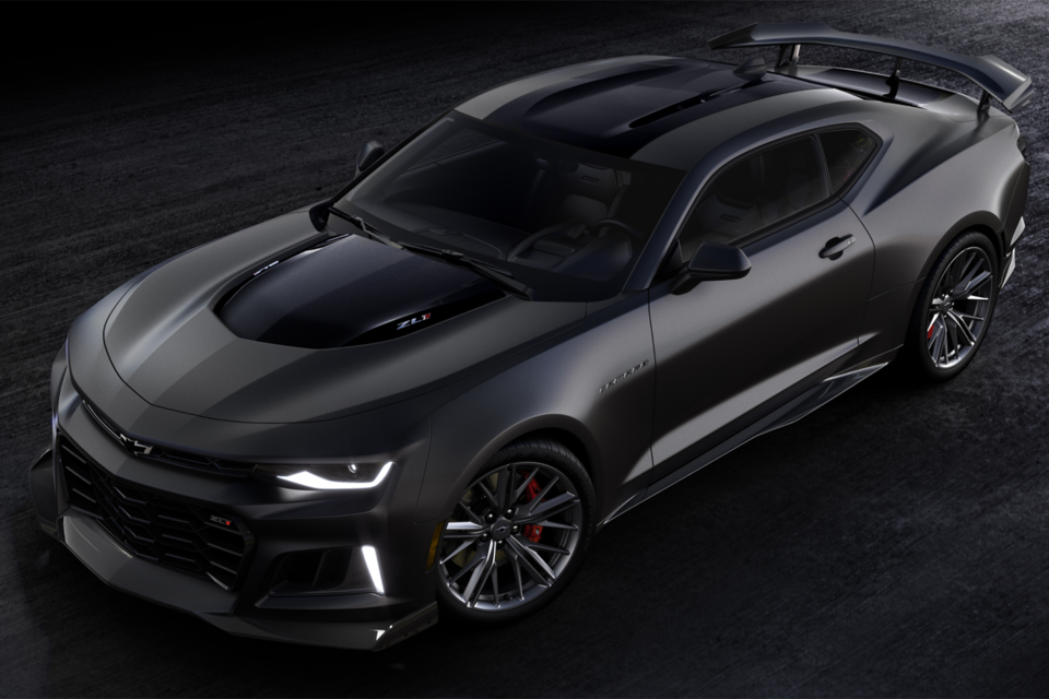 Birds Eye View Of The 2024 Chevy Camaro ZL1 Parked In A Warehouse With Head Lights On