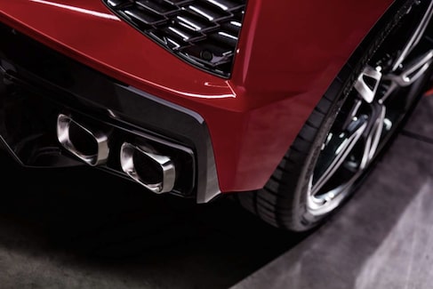 the back passenger side of a red sports car