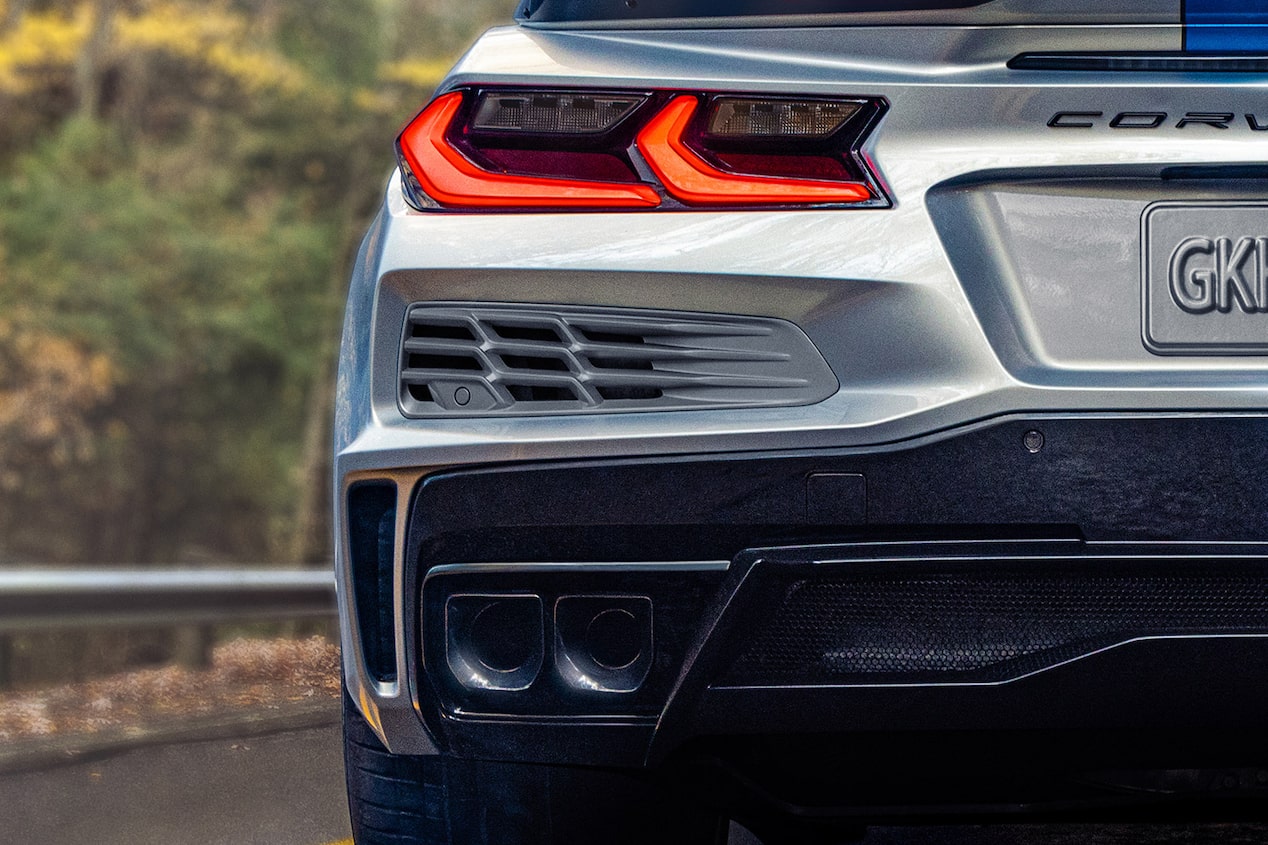 Rear End View of the 2024 Chevrolet Corvette E-Ray Driving Through a Forest