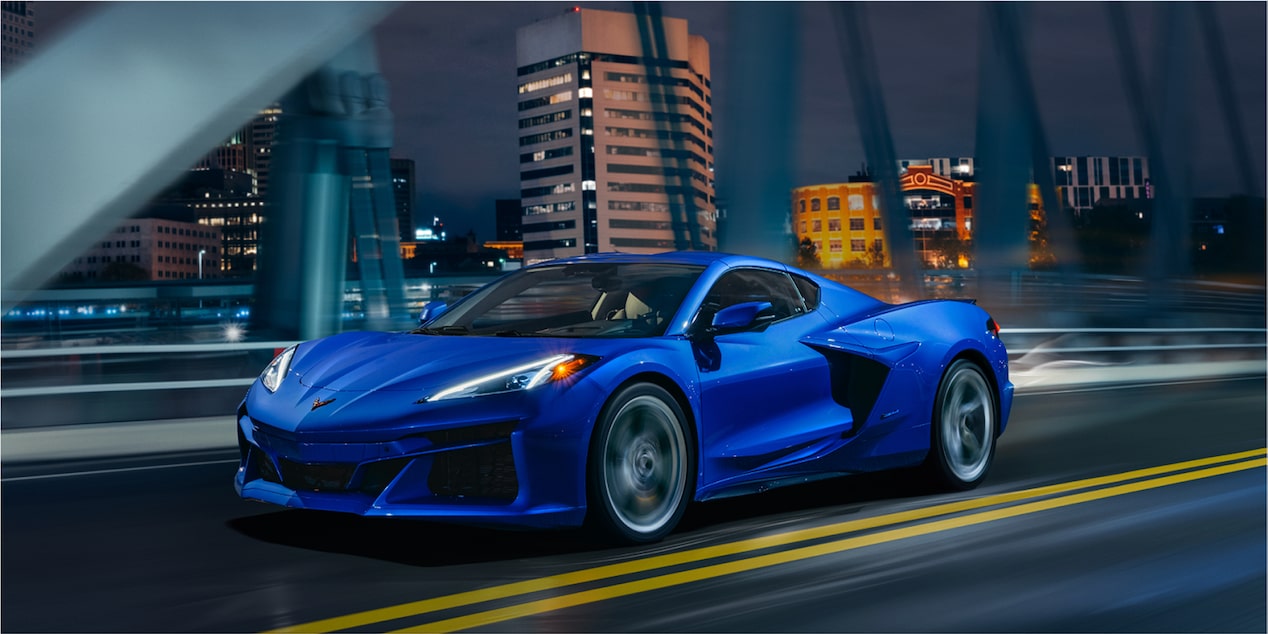 2024 Chevrolet Corvette E-Ray Driving on City Bridge At Nighttime