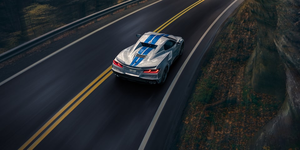 The Corvette E-Ray Driving on an Open Mountain Road During Sunset