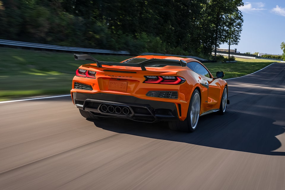 A 2024 Corvette Z06 Cruises on an Open Roadway on a Clear Day
