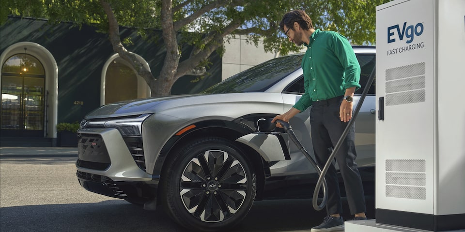 Man Charging his 2024 Blazer EV at Evgo Fast Charging Location