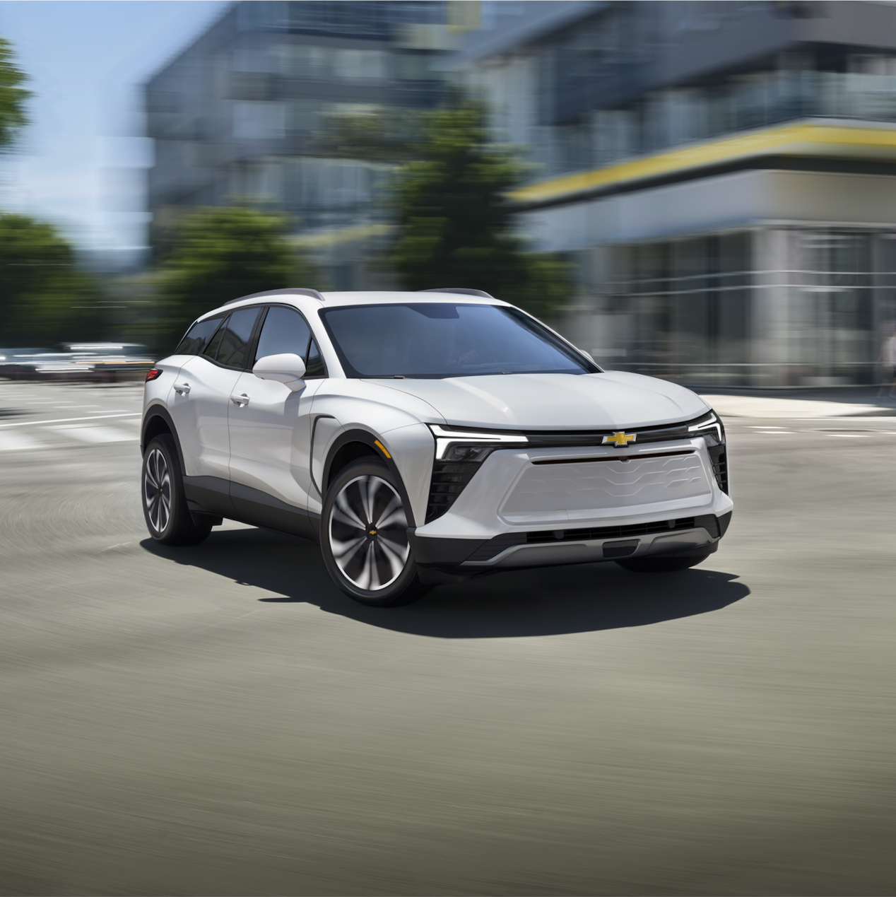 Front 3/4 view of Blazer EV driving Through the City
