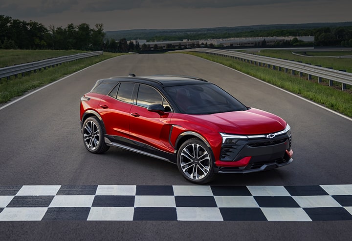Radiant Red 2024 Chevy Blazer EV Parked on an Open Road