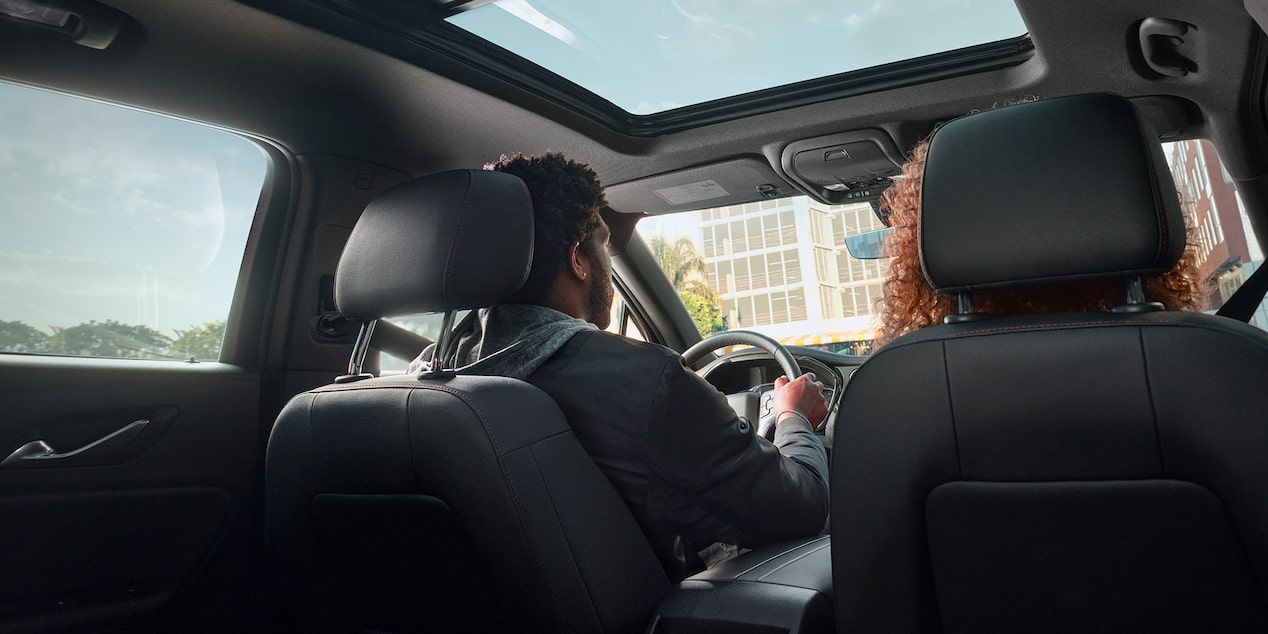 View of Moonroof and People Sitting in the Front Seats in a Chevrolet Blazer SUV