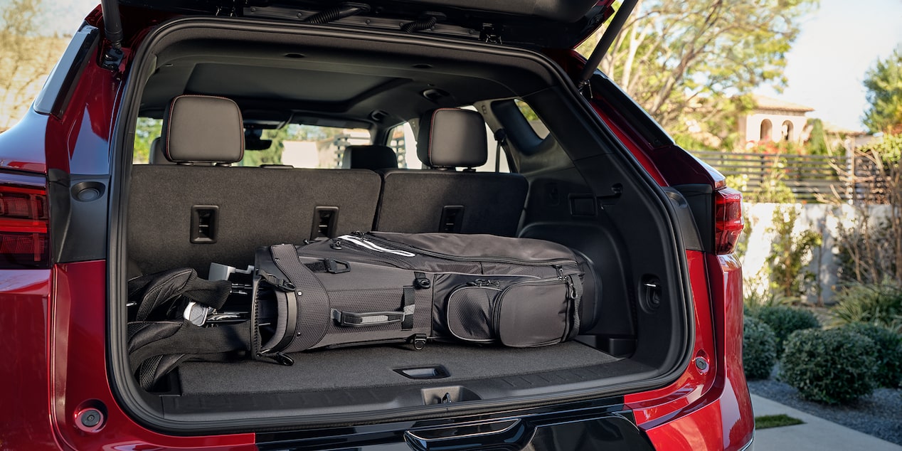 View of the Trunk of a Chevrolet Blazer SUV Holding a Set of Golf Clubs