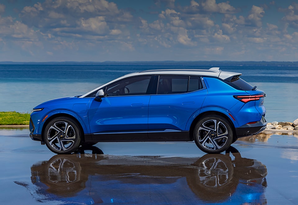 2024 Equinox EV Driver's Side Profile Shot on Reflective Surface