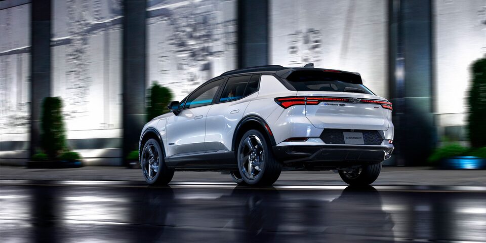 2024 Equinox EV Rear 3/4 Driving Shot at Night