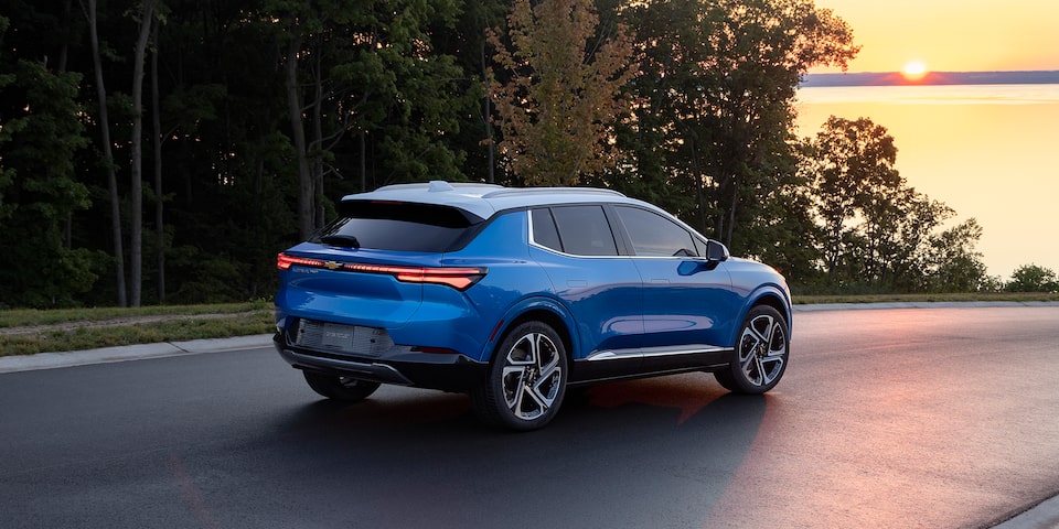 2024 Equinox EV Rear 3.4 Shot of Vehicle at Sunset