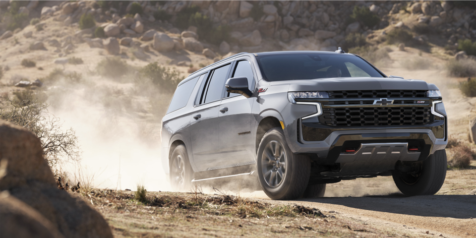 The Sterling Grey Metallic MY24 Chevy Suburban Driving on a Desert Off-Road