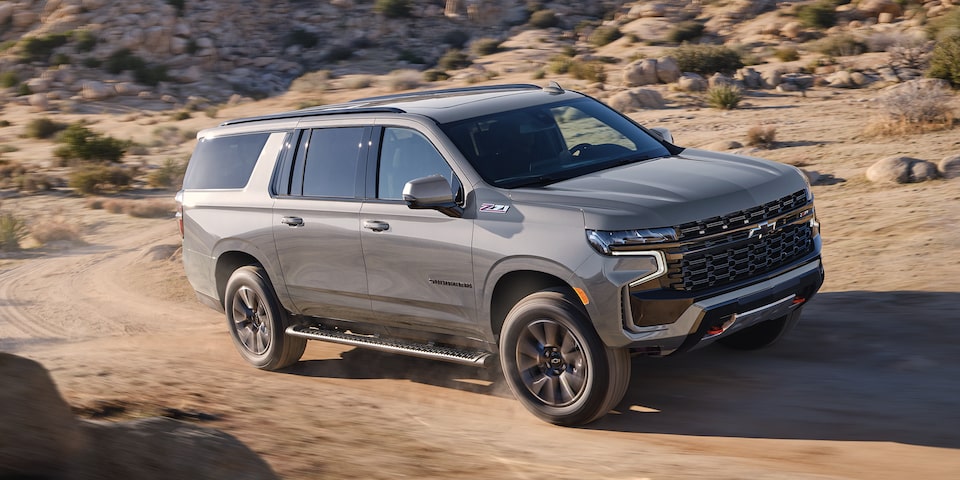 The Sterling Gray Metallic MY24. Chevy Suburban Driving on a Desert Off-Road