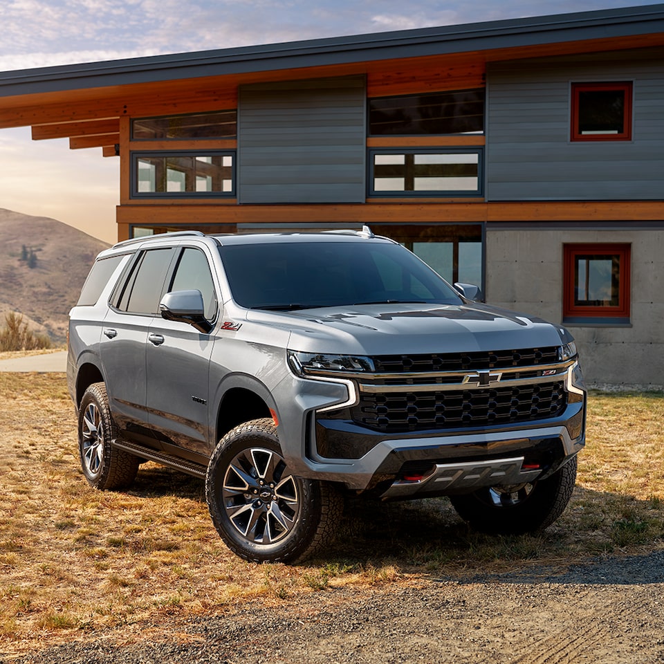 The 2024 Chevy Tahoe Parked in Front of a Modern Home
