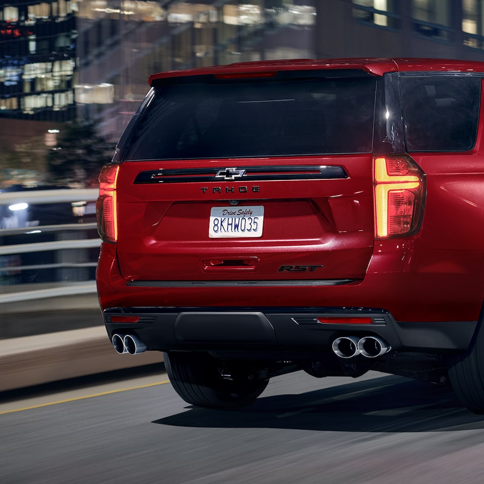 Rear View Of The 2024 Chevy Tahoe RST Performance Edition Driving In The City