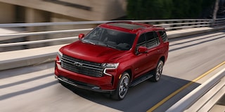 2024 Chevy Tahoe Driving Over A Highway Bridge