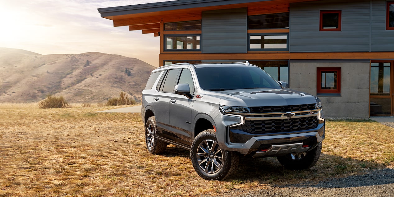 The 2024 Chevy Tahoe Parked in Front of a Modern Home