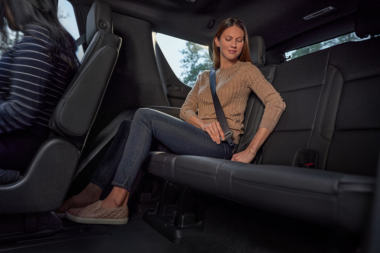 2024 Chevrolet Tahoe Interior View Of Women Using Back Seat Seatbelt