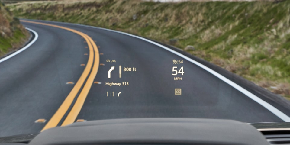 Available Heads-Up Display Technology In The 2024 Chevy Tahoe In Action On An Open Road