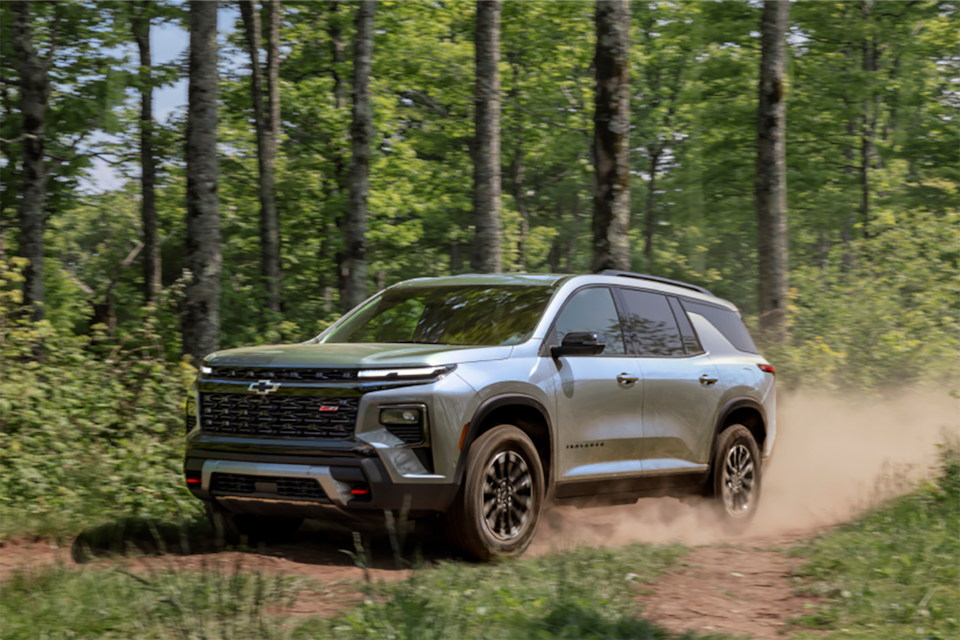 2024 Chevy Traverse Mid-Size SUV Driving on a Dirt Road