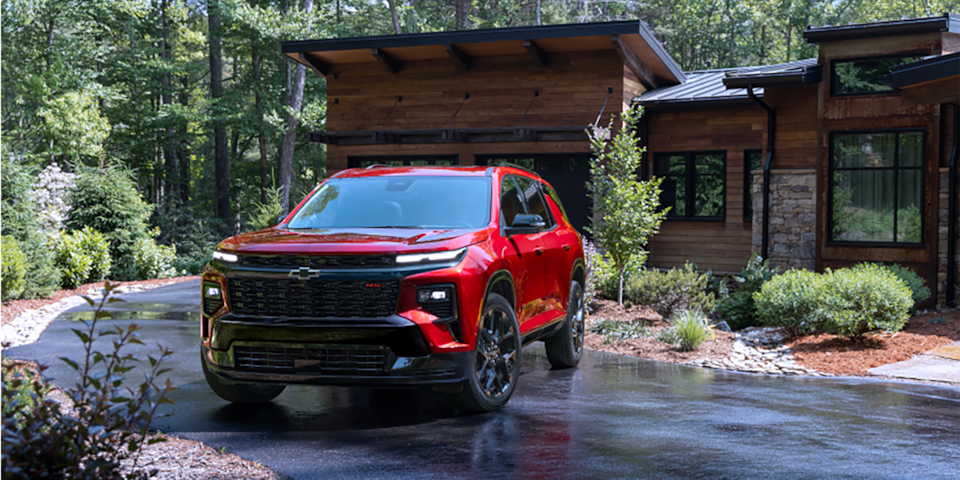 Chevy Traverse Parked at a House in the Woods