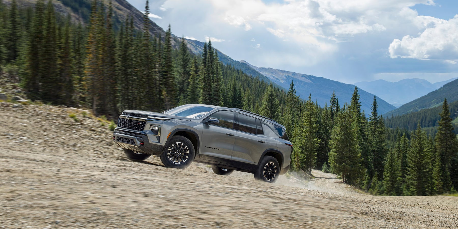 2024 Chevy traverse driving up a gravel slope