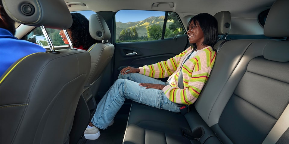 Backseat Passenger Smiling & Highlighting Chevy Trax
