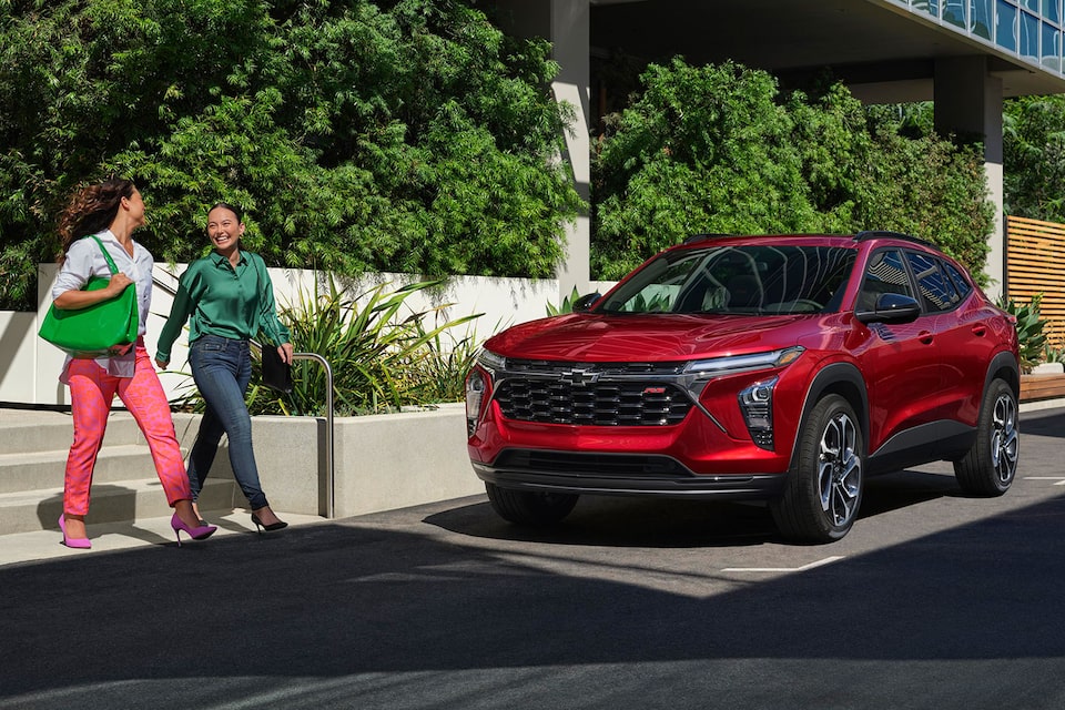 Women Crossing Street & 2024 Chevy Trax in the Background