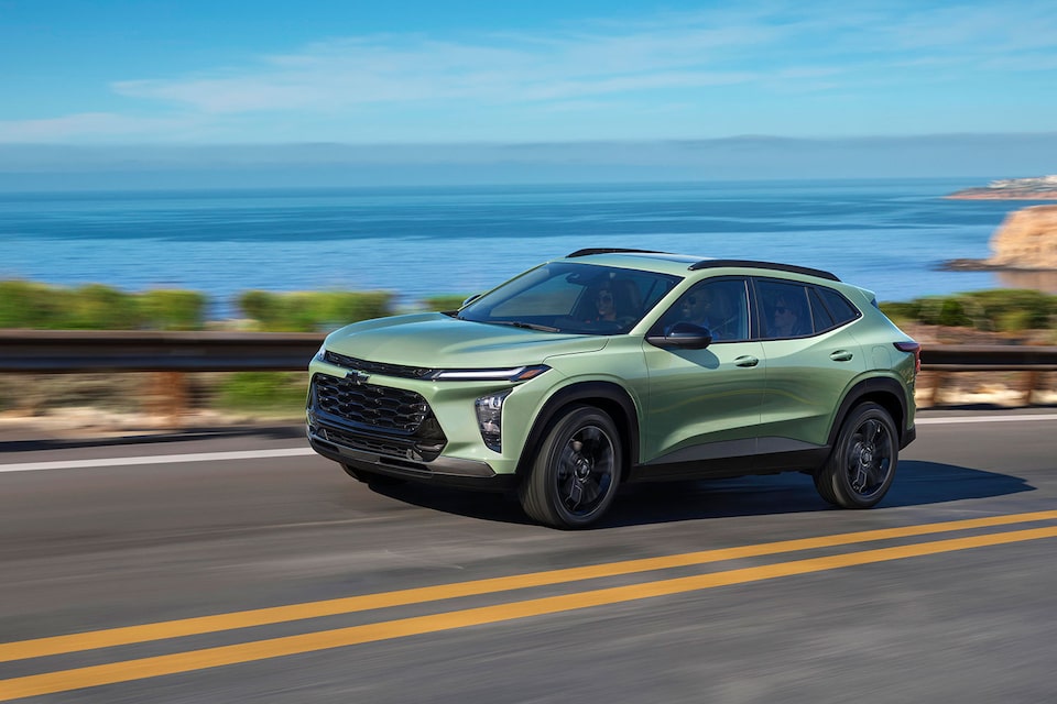 Chevy 2024 Trax Driving Swiftly on Waterfront Road