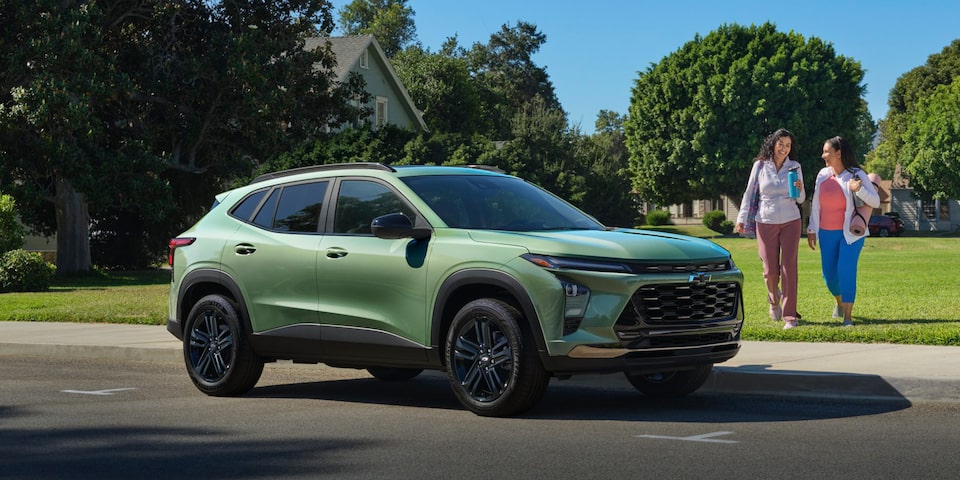 Friends Approaching a Parked 2024 Chevy Trax