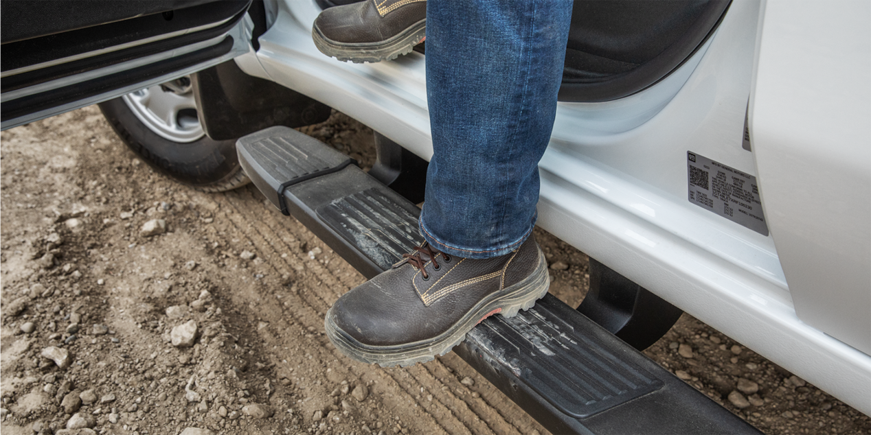 Person Utilizing Accessory Assist Steps of Silverado HD