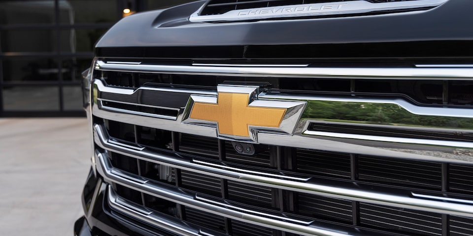 The Gold Chevrolet Bowtie and Front Grille of the 2024 Silverado HD