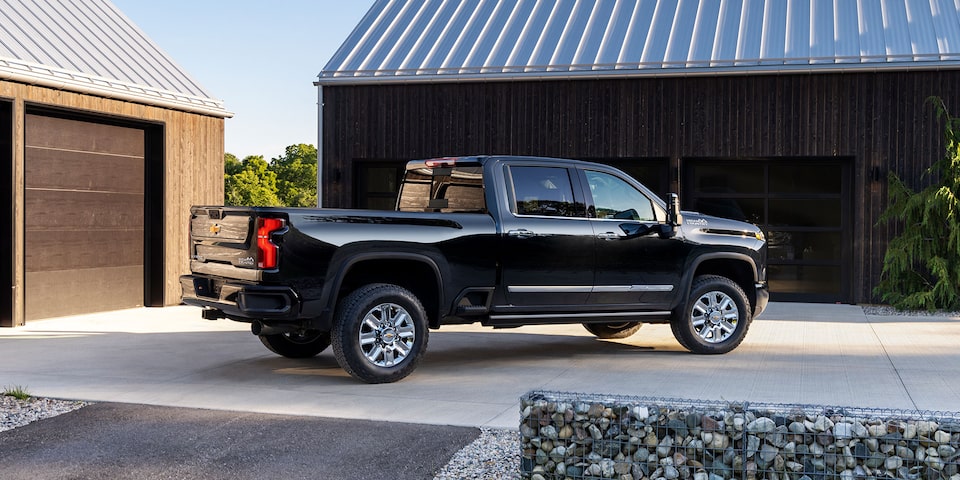 The Black Silverado HD Parked in Driveway of a Modern Ranch Style Home