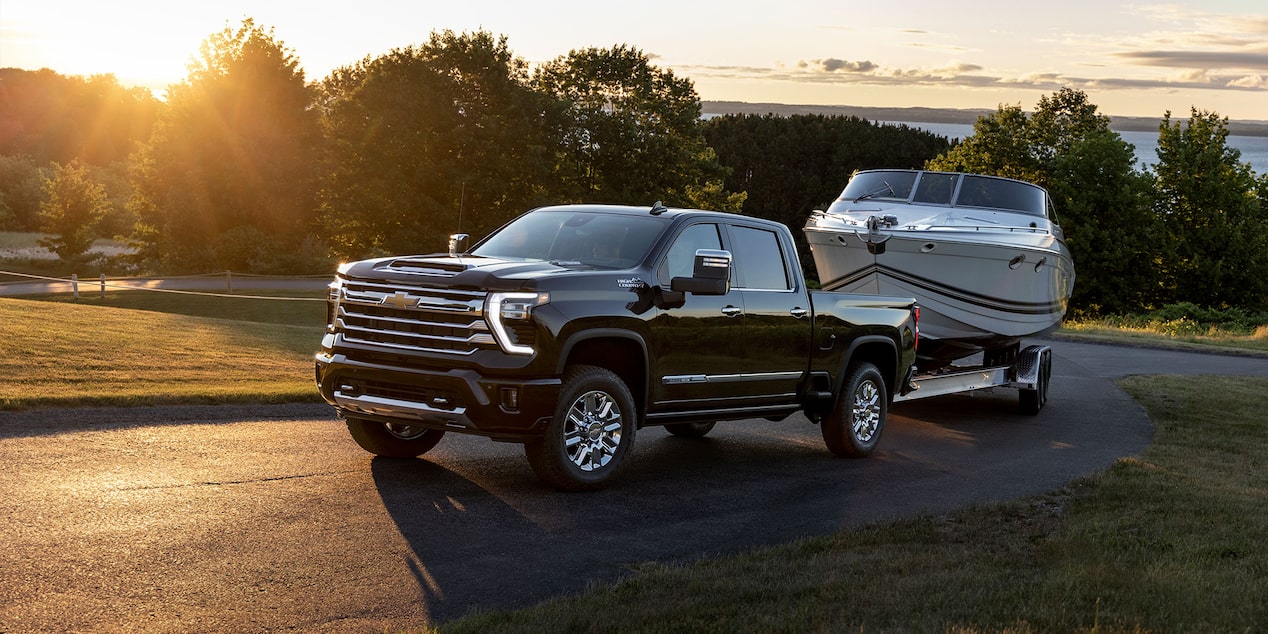 2024 Silverado HD Towing a Boat at Sunset