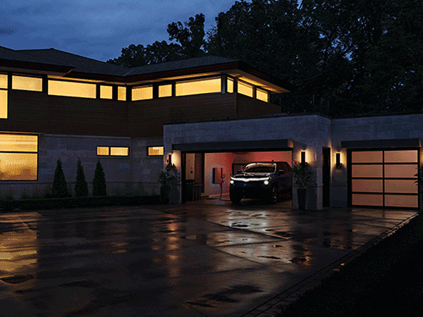 2024 Silverado EV in Front of Modern Home
