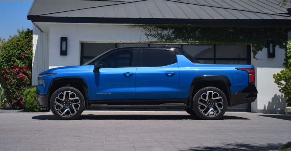 Side-Profile View Of The 2024 Silverado EV Parked In A Driveway