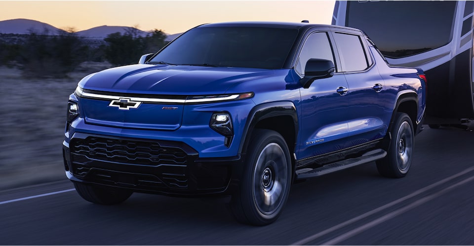The 2024 Silverado EV Towing A Large RV Camper