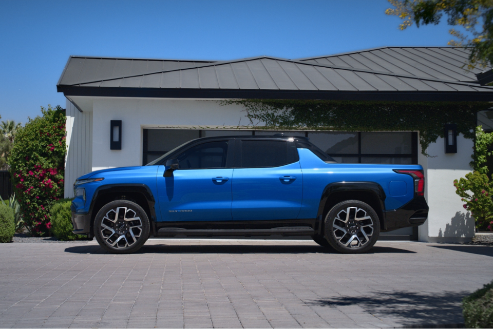 Side-Profile View Of The 2024 Silverado EV Parked In A Driveway