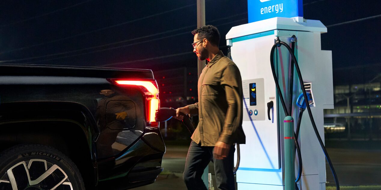 Man Using a Public Charging Station